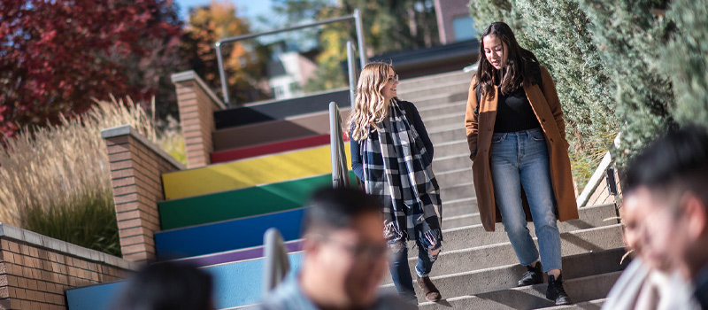 two students walking down Pride stairs
