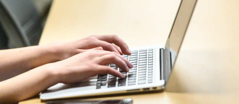 Laptop being used for typing